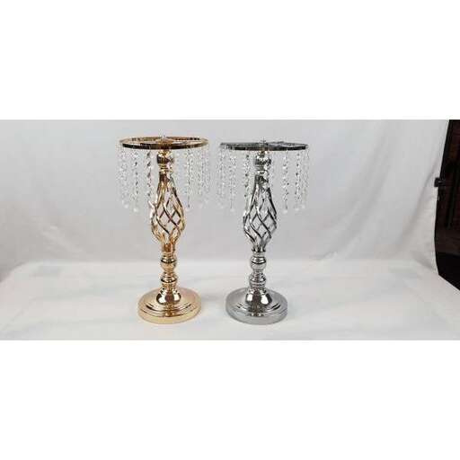 a pair of candlesticks with a white background.