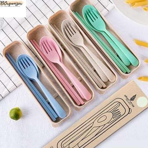 a set of colorful spoons in a wooden box.