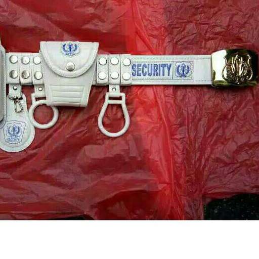 police officer's gun on a red plastic sheet.
