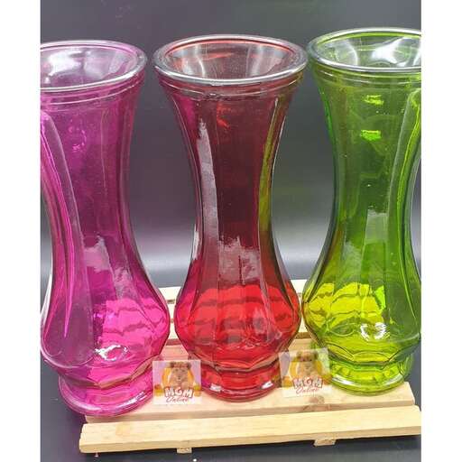 a set of three colorful glass vases.