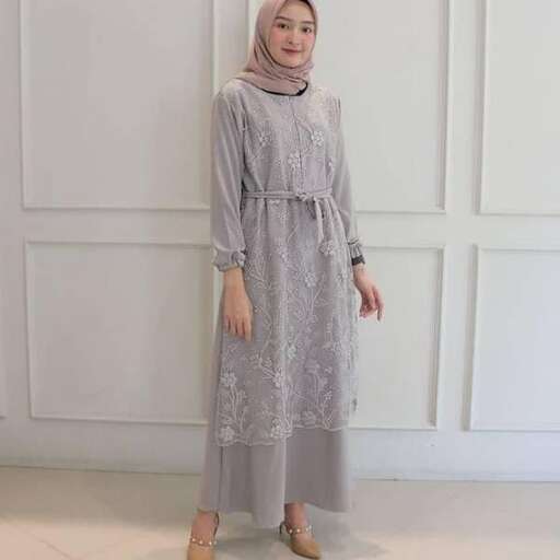 a woman in a grey dress