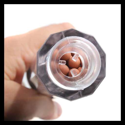 a bottle of pills in a hand