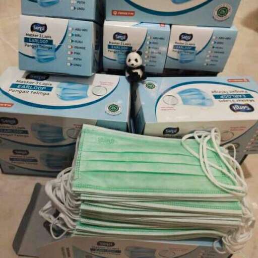 a box of tissues with a panda bear on top of it.