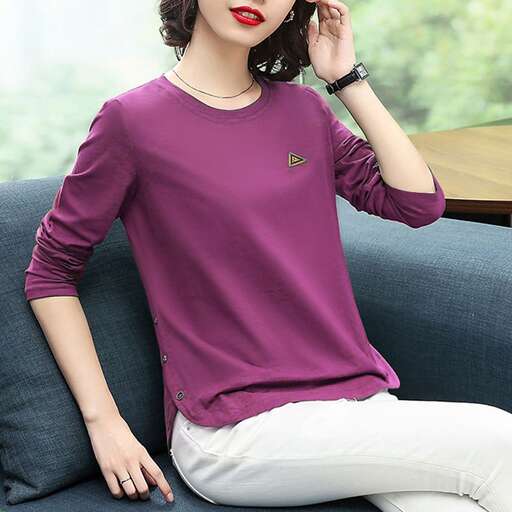 a girl in a purple shirt and white pants