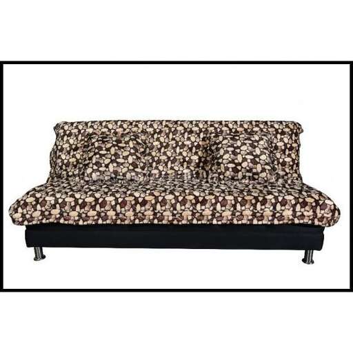 a black and white picture of a couch and a floral print