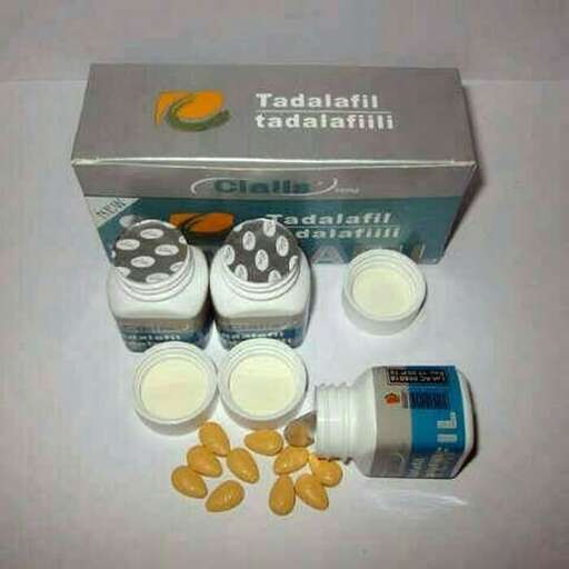 a box of pills and a bottle of milk.