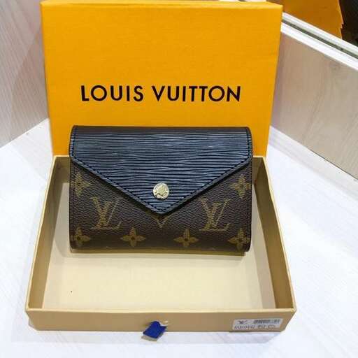 a box with a gold box on top of it.