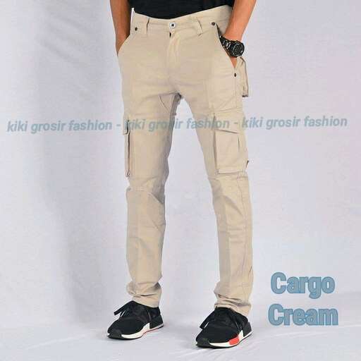 a man in khaki pants and a black t - shirt.