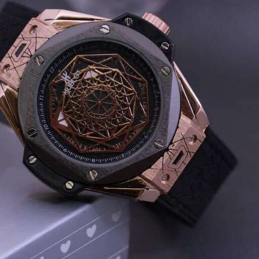 watch - - a watch that's designed for a man who is wearing a watch