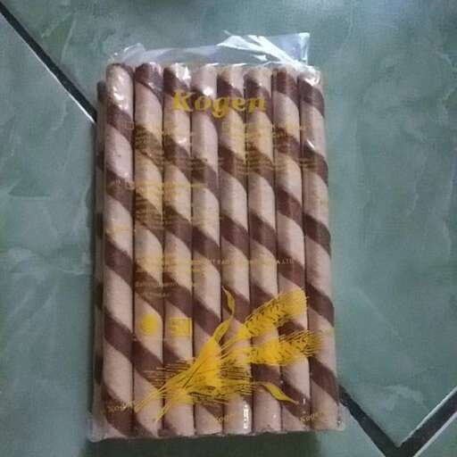 a package of fish wrapped in plastic on a kitchen counter.
