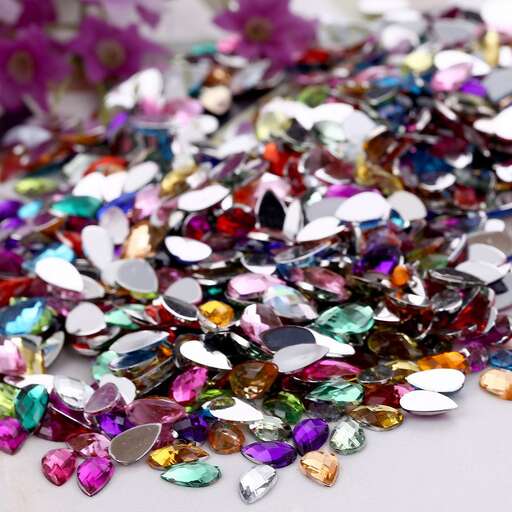 a close up of a pile of multicolored gemstones