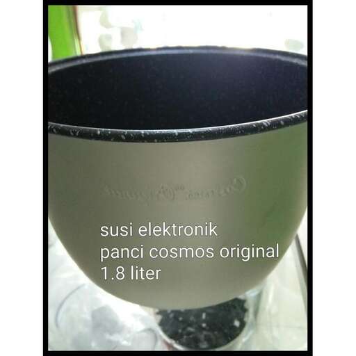 a large metal cup with a black base and a green and white background.