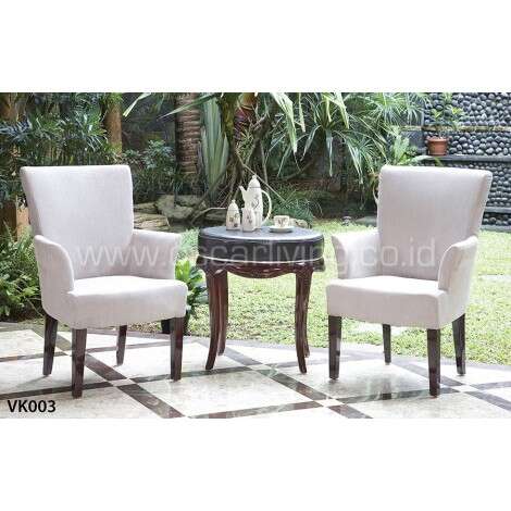 a pair of chairs sitting on a patio.