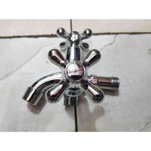 the faucet in the bathroom is made of stainless steel.