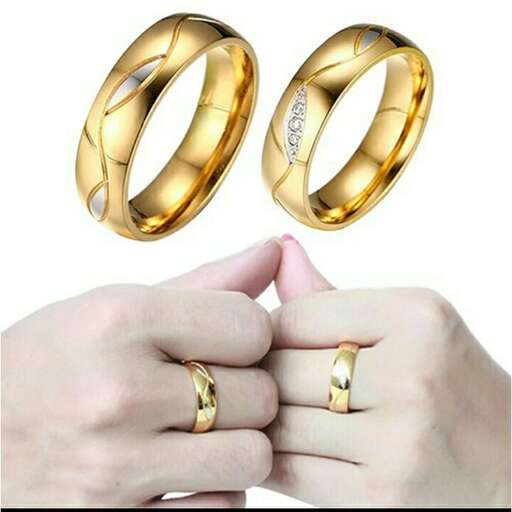 a pair of gold wedding rings