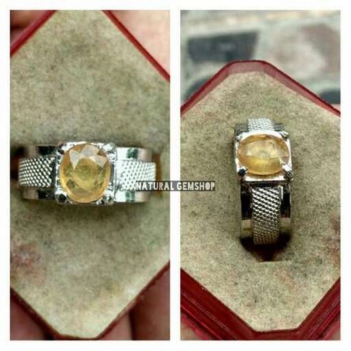 a yellow gold and diamond ring with a diamond.