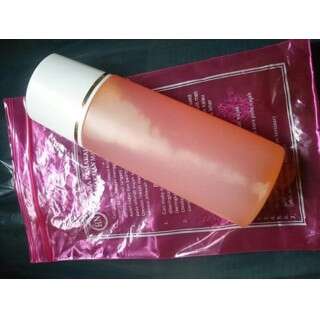 a pink bottle in a plastic bag.