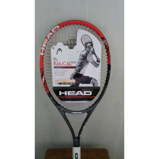 a tennis racket with a picture of a tennis player on it.