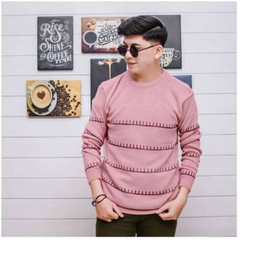 a long sleeved pink sweater with a zipper.