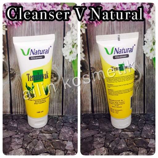 a white bottle with green and white shampoo.
