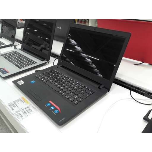 a desk with a laptop and a desktop computer on it.