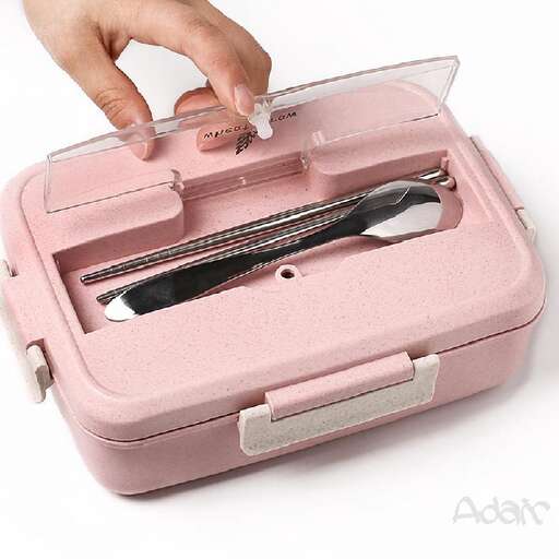a pink box with a pair of scissors in it.