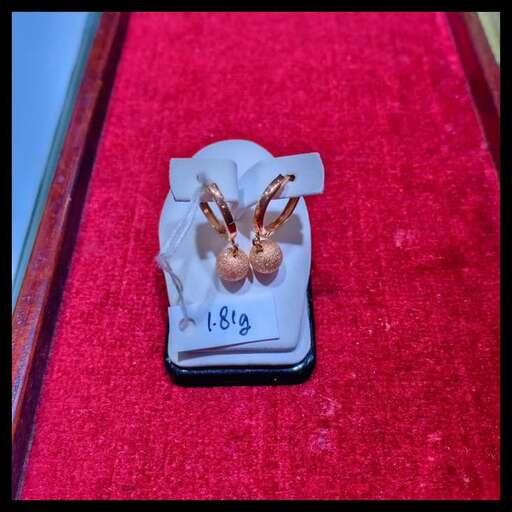 gold earrings in a box