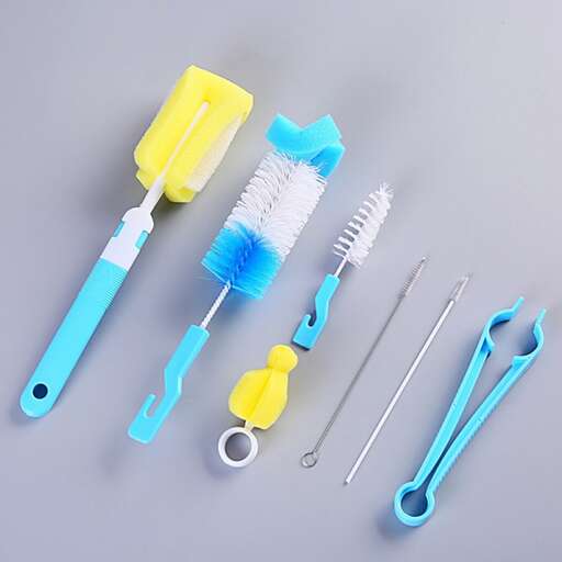 a group of dental tools on a gray surface.