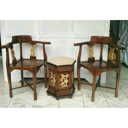 pair of chairs in the style of person