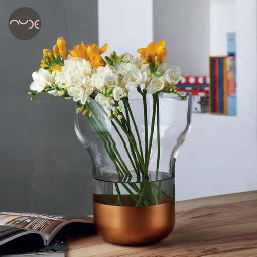 vase with flowers in a gold vase