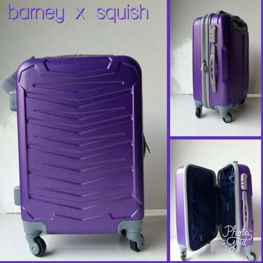 a purple suitcase with wheels and wheels on wheels.