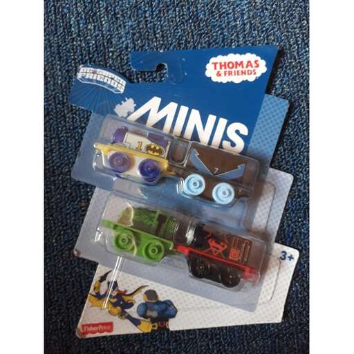 a set of mini cars on a blue carpet.