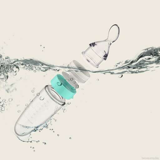 a bottle of water that is being splashed