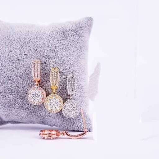 a cushion with a pair of earrings and earrings.