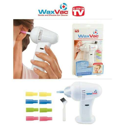 a woman is brushing her hair with a blow dryer.