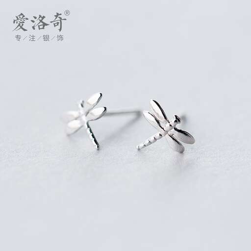 a pair of earrings with a flower shaped flower