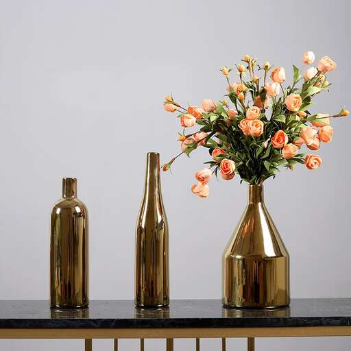 a table with a vase and vases on it