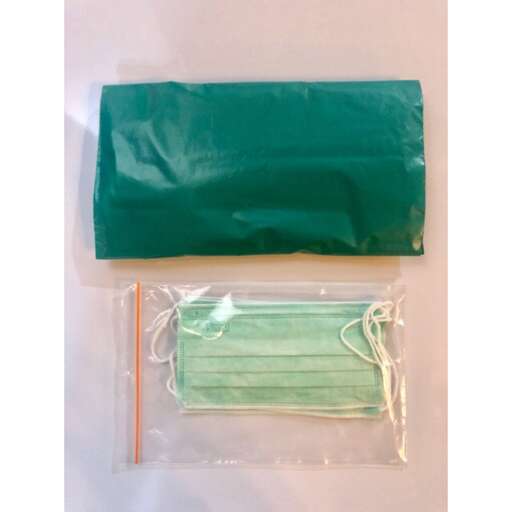 a green bag with a white thread and a green bag.