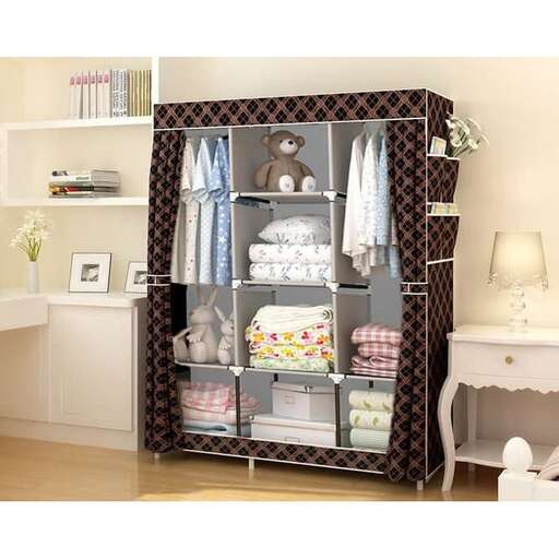 a closet with a shelf of clothes and a teddy bear.