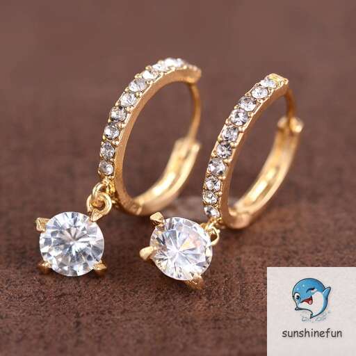 a pair of 18k yellow gold and diamond rings