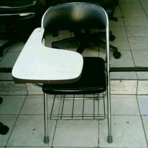 a chair with a white back and black seat.