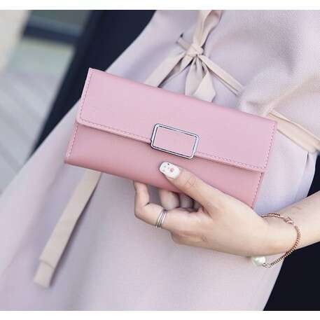 a pretty pink dress with a bow.