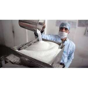 a person in scrubs is making sugar.