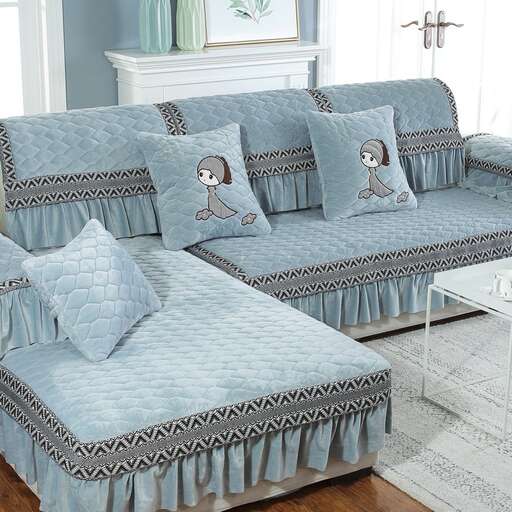 a blue and white living room with a couch and a table.