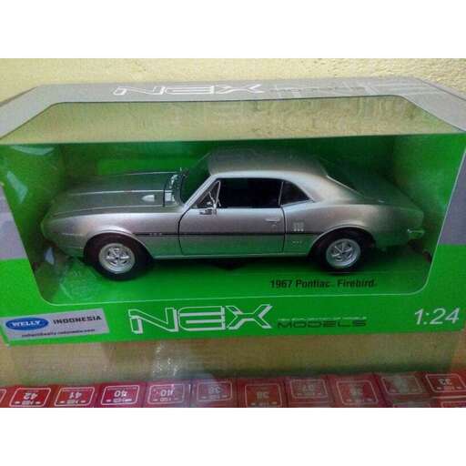 a toy car in a green box on a table.