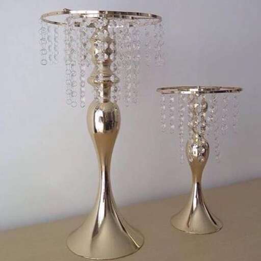 a pair of silver candlesticks with sparkling crystals.