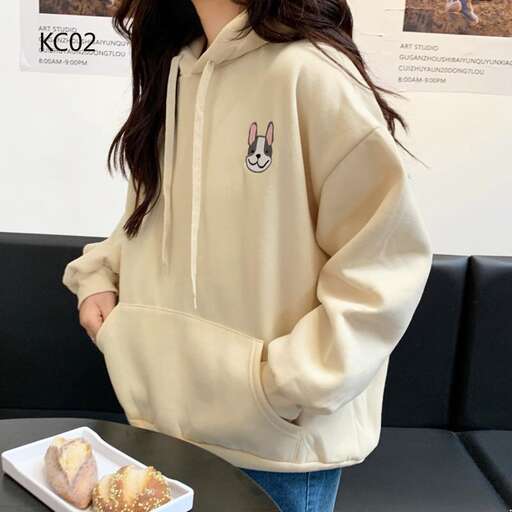 the jacket is a long sleeved shirt with a hoodie and jeans.