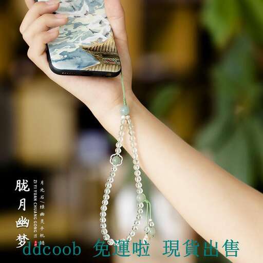 a person holding a cell phone in their hand.