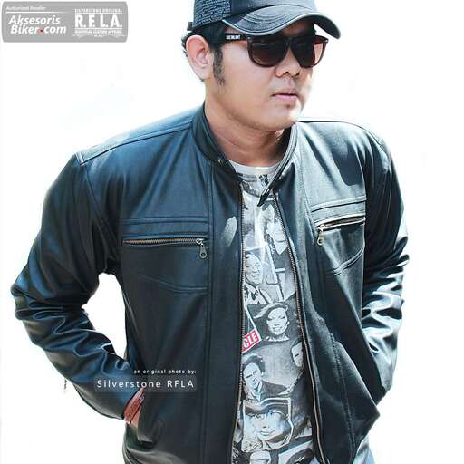 person is a man in a leather jacket and sunglasses.