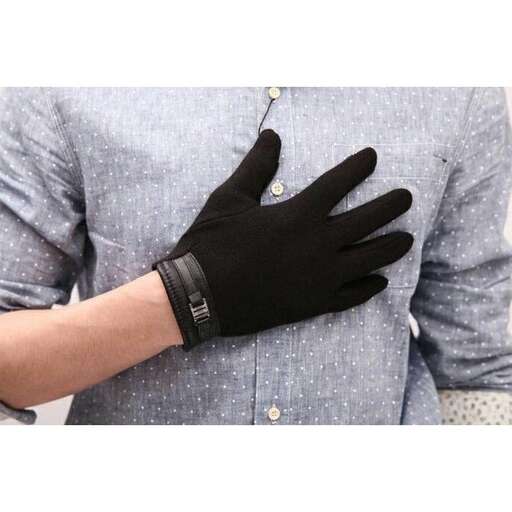 a pair of black gloves with a silver buckle.